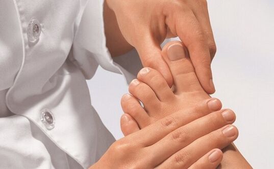 specialist examines feet for fungal infections